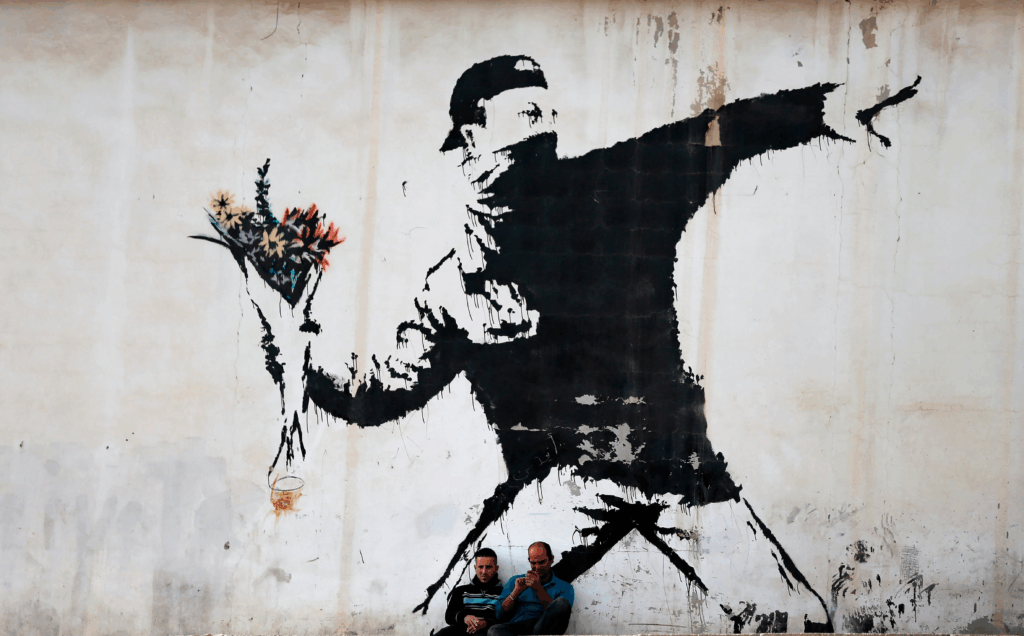 Fresque de Banksy, célèbre artiste street art engagé