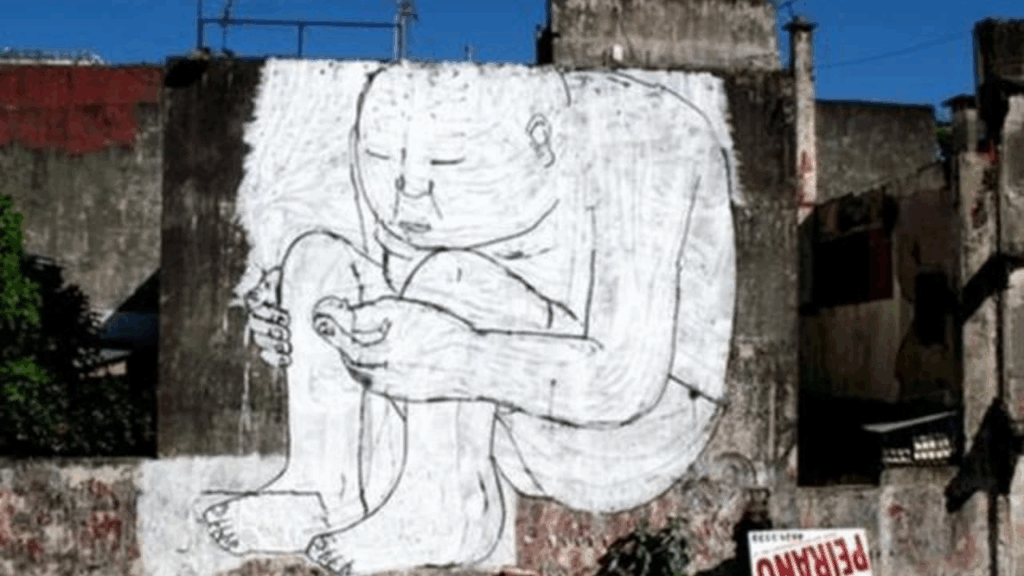 Fresque de Blu, artiste street art engagé, représentant une scène anticapitaliste et surréaliste sur un mur urbain
